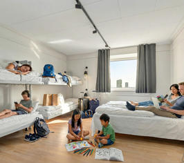 Family with children staying in a large room with bunk beds