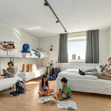 Family with children staying in a large room with bunk beds
