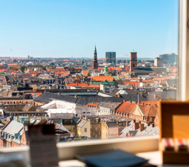 View over Copenhagen through a window from a room