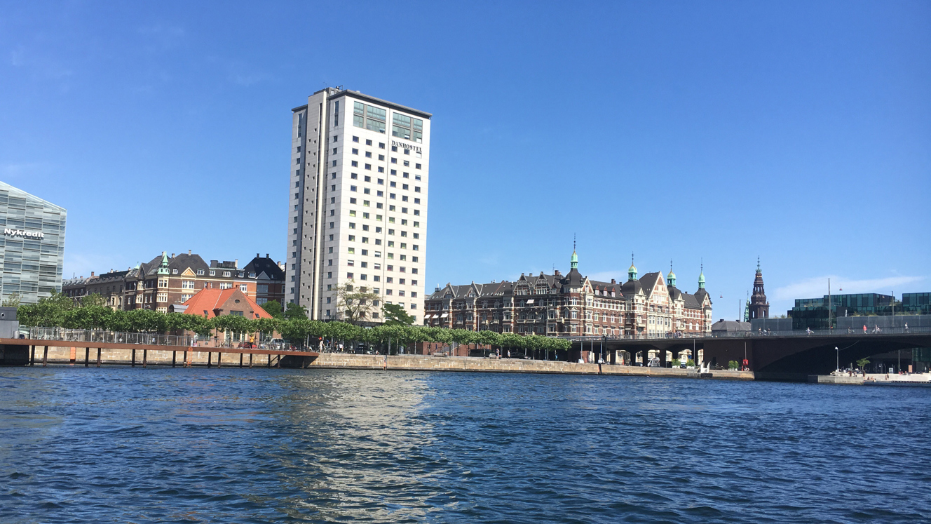 Danhostel building seen from the water with city in the background