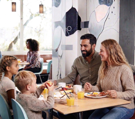 Family having breakfast together in BAR50