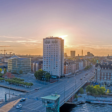 View of bridge and Danhostel building in evening sunlight